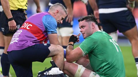 James Ryan receives treatment on his hand injury