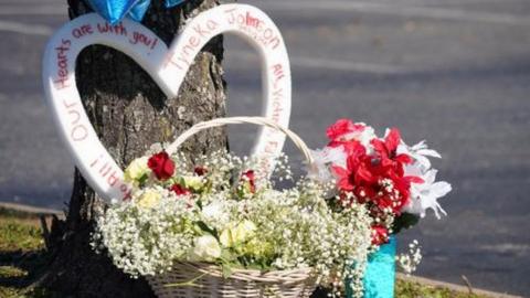 A memorial is seen in the parking lot after a mass shooting at a Walmart in Chesapeake, Virginia