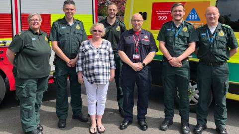 Diane Fenton with emergency team who helped her