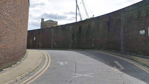 A google image of Friary Passage in Guildford, with the wall on the right-hand side backing onto the Electric Theatre