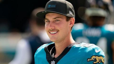 Jacksonville Jaguars kicker Cam Little smiles as he walks the field during an NFL game against the Houston Texans
