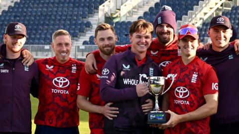 England players celebrate with the trophy for winning the T20 series against Ireland