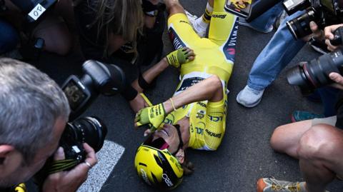 Pauline Ferrand-Prevot lies on the ground after winning the Tour de France Femmes
