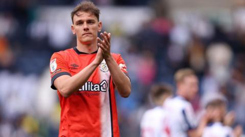 Kal Naismith applauds the Luton supporters