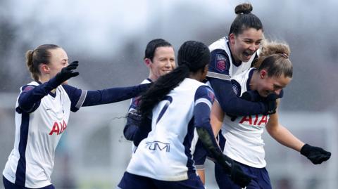 Tottenham players celebrate with Olivia Holdt after her stoppage-time winner on debut at Crystal Palace