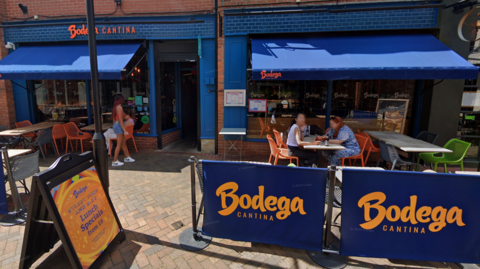 Exterior shot of Bodega Cantina in Leicester with people eating outside