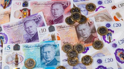 King Charles III polymer banknotes £5, £10, £20, £50 and £1 pound coins. Polymer Five Pound note, Ten Pound note, Twenty Pound note and Fifty Pound note.