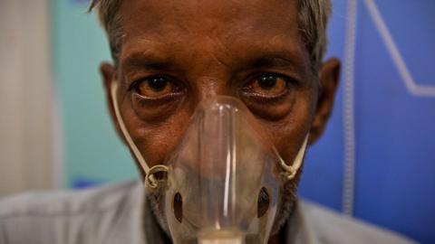 Man using nebuliser to treat asthma