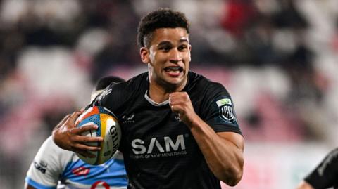 Cormac Izuchukwu runs clear with the ball tucked under his arm