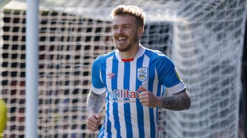 Danny Ward smiling while playing for Huddersfield Town