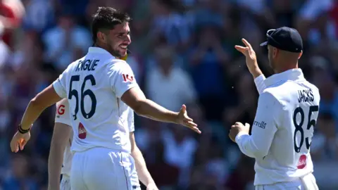 Josh Tongue celebrates the wicket of Josh Inglis