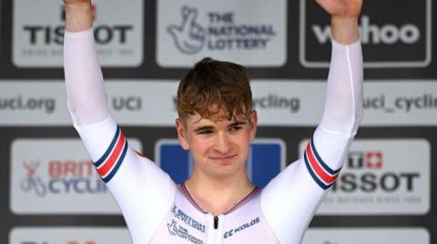 Great Britain's Ben Wiggins celebrating with his arms aloft