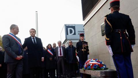 French President Emmanuel Macron (2ndL) and Saint-Denis mayor Laurent Russier (L) at Stade de France wreath-laying, 13 Nov 17