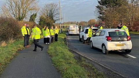 Police officers conducting roadside checks for drug and drink driving on the A59 at Robin Island on vehicles