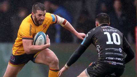 Stuart McCloskey of Ulster in action against Sam Davies of Dragons