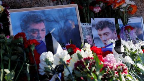 Flowers placed at a memorial to Boris Nemtsov