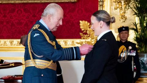 Police Constable Rhona Adams is decorated with the King's Commendation for Bravery by King Charles III, during an investiture ceremony at St James's Palace, London.