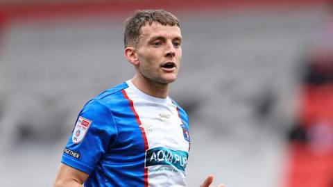 Sam Lavelle on the pitch during a game for Carlisle