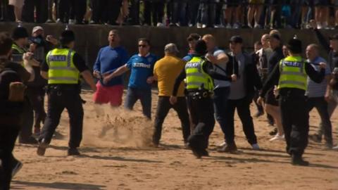 Scuffle on the beach