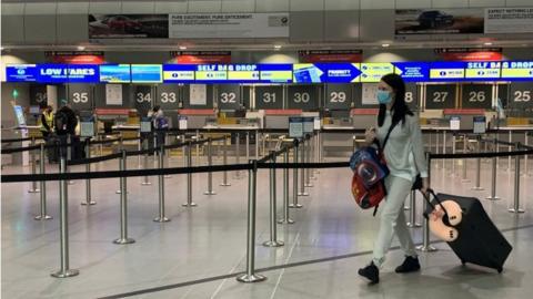 Passenger in mask at Manchester Airport