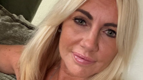 A woman with blonde hair in close up