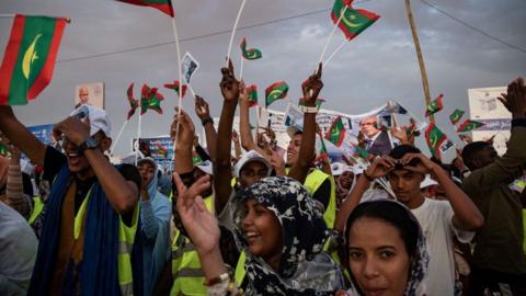 Mauritians stand in a political rally ahead of the presidential elections