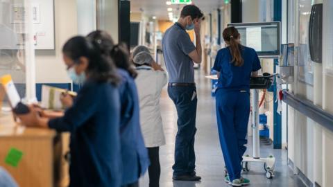 Staff at work in a hospital corridor