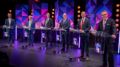 The party leaders on stage at the debate