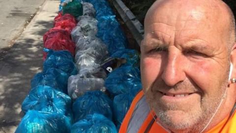 Scott Gibbins with the rubbish bags