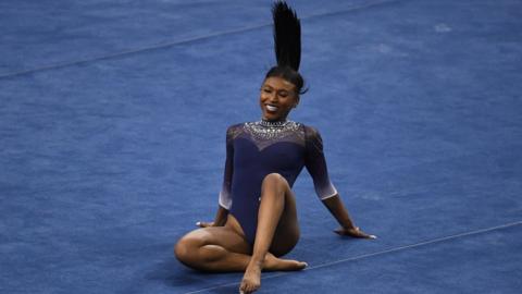 UCLA Bruins gymnast Nia Dennis competes in the floor exercise against the Arizona State Wildcats during the season opener in Pauley Pavilion on the campus of UCLA in Los Angeles on Saturday, January 23, 2021.