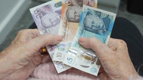 Person holding bank notes