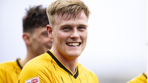Newport County player Will Evans smiles