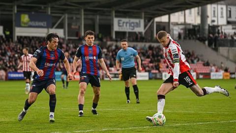 James McClean tries a shot