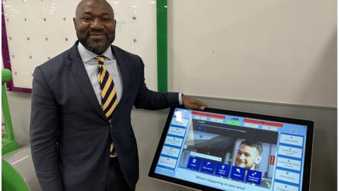 Festus Akinbusoye smiling with one of the terminals