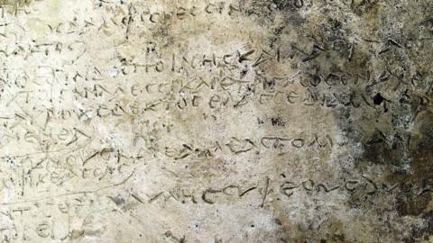 A handout photo made available by the Greek Ministry of Culture shows a clay tablet with an engraved inscription of a rhapsody in 鶹Լr's "Odyssey" on 10 July 2018