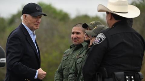 US President Joe Biden (L) speaks with US Border Patrol agents as he visits the US-Mexico border in Brownsville, Texas, on February 29, 2024.