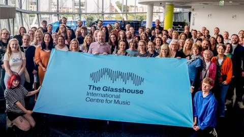 The Glasshouse logo on a banner