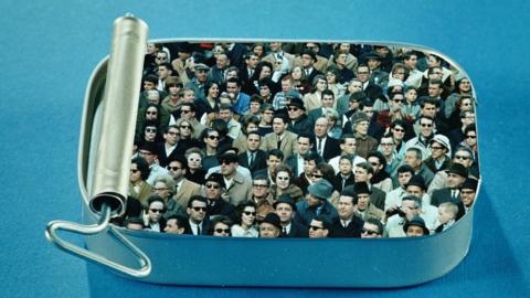 people in a sardine tin