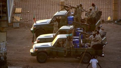 Sudanese army troops fire in the air