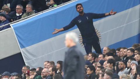 A Pochettino flag overlooks Mourinho