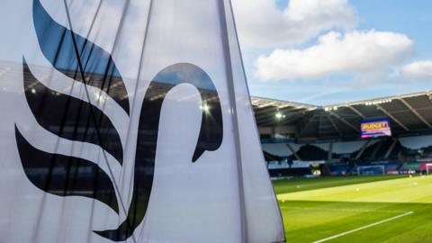 Swansea City flag and stadium