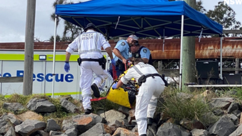 Investigators searching the area after the diver and suspected-cocaine packages were found in the Hunter River in Newcastle, New South Wales on Monday