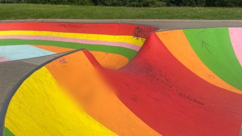 Skatepark with rainbow-coloured flooring