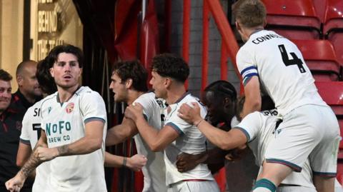 Walsall players celebrate their goal against Bristol City in the Carabao Cup