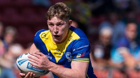 Matty Nicholson carrying the ball for Warrington Wolves