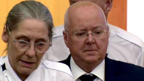 Peter Murrell is led into court by guards