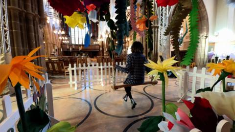 Mandeep Dhadialla on the swing in Leicester Cathedral