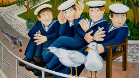 Four men dressed in blue sailor suits and hats are siting smoking on a bench in a park. Two seagulls are  perched on a rail in front of them and one has its beak open and appears to be squawking.