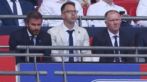 Salford co-owner David Beckham (left) and football director Paul Scholes sit either side of chief executive Gavin Fleig at Wembley