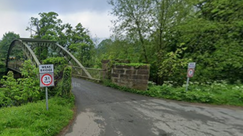Metal bridge over the River Wharfe in Ilkley.